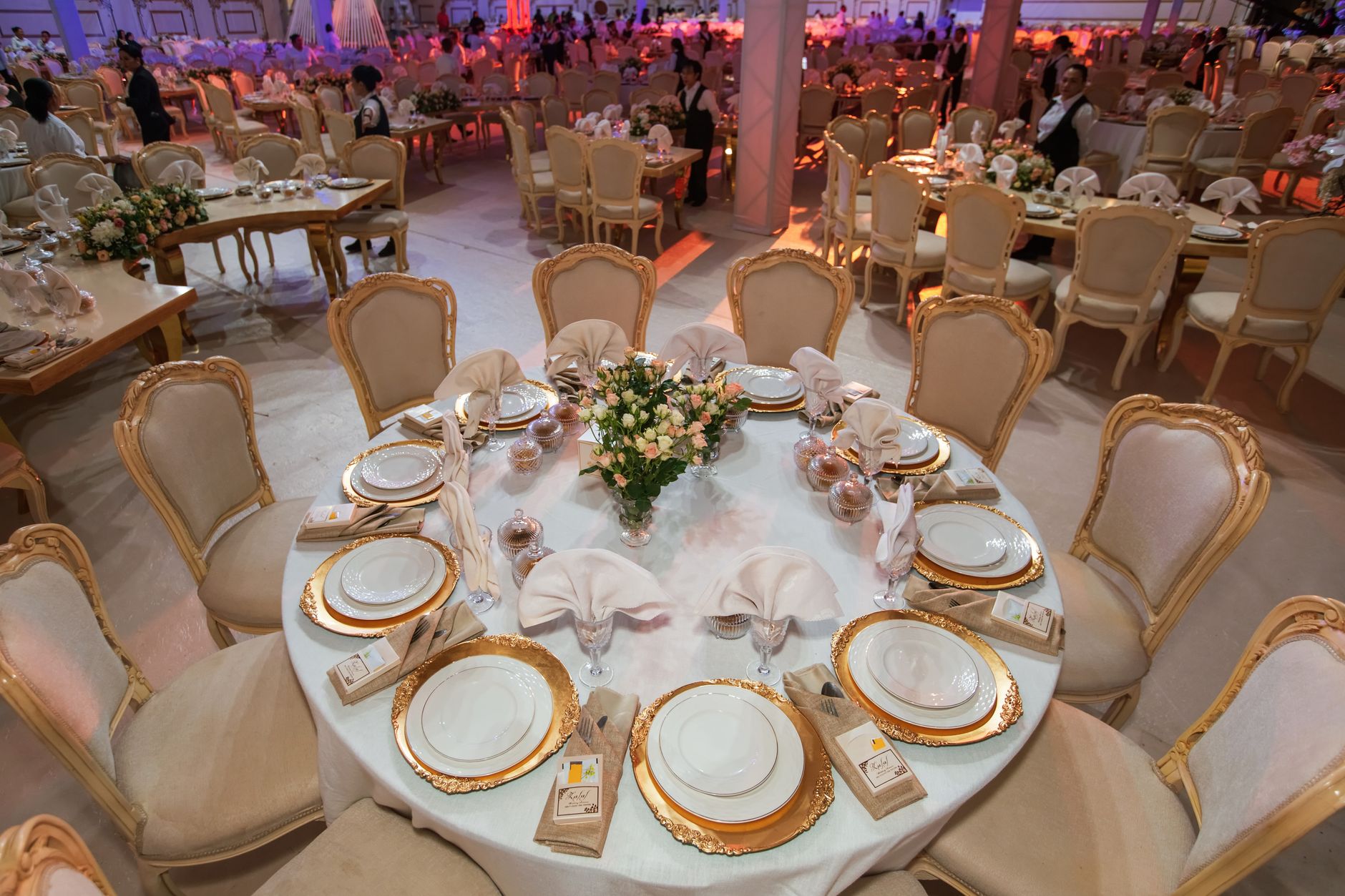 Luxurious wedding reception with elegantly decorated tables and chairs in an opulent setting. — Double Barn Door Hardware Cre